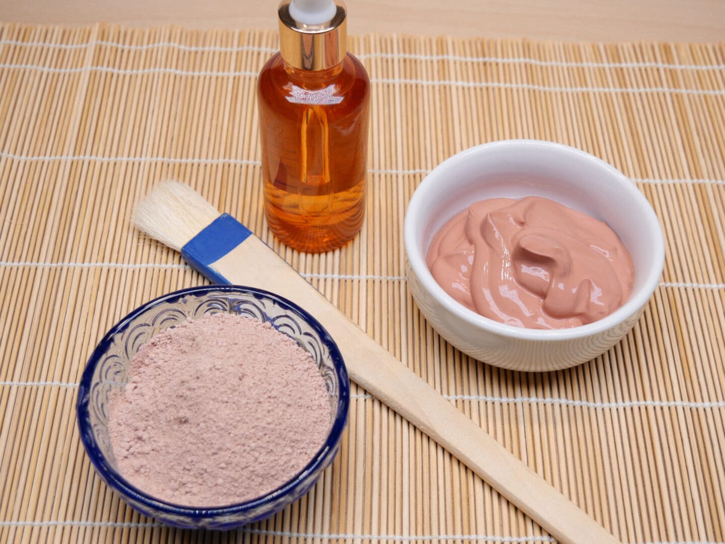 A French Pink Clay Face Mask Powder for Dry, Sensitive Skin and a brush.