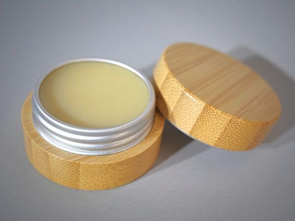 A wooden container with a cream on top of it.