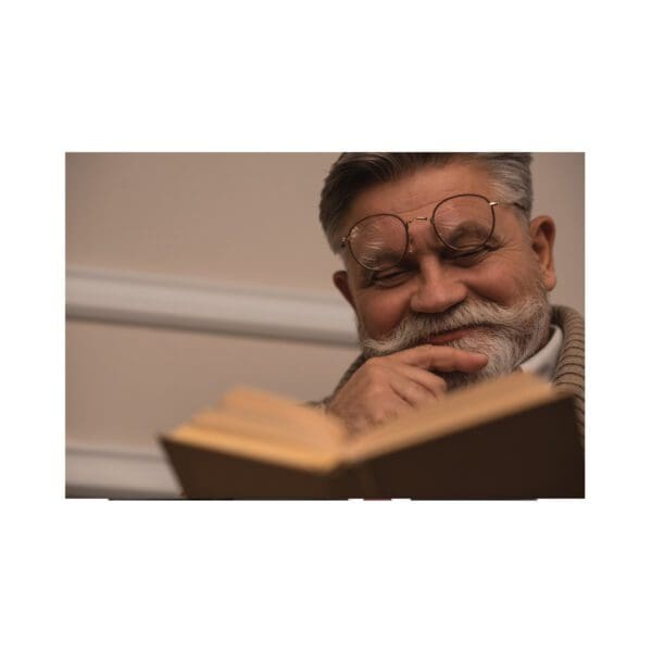 A man with a beard and mustache reading.